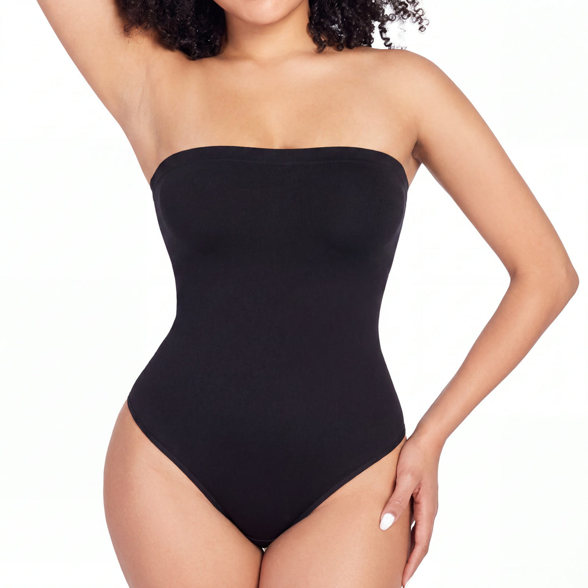Strapless seamless shaping bodysuit in black, worn, front view, photographed on white